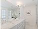 Elegant bathroom featuring marble countertops, dual sinks, and glass shower at 370 Landing Entry, Johns Creek, GA 30022