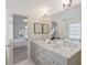 Bathroom with double vanity, granite countertops, and large mirror at 370 Landing Entry, Johns Creek, GA 30022