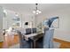 Dining room adjacent to the living room, hardwood floors, crown molding and stylish decor at 370 Landing Entry, Johns Creek, GA 30022
