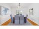 Formal dining room with modern decor, a large window, and hardwood floors at 370 Landing Entry, Johns Creek, GA 30022