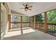 Comfortable screened porch with natural light and a ceiling fan for relaxation and outdoor enjoyment at 370 Landing Entry, Johns Creek, GA 30022