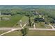 Scenic aerial view of homes with lush green surroundings and agricultural land at 14807 Highway 36, Covington, GA 30014