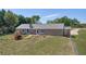 The backyard features a patio with outdoor seating, lawn, and mature trees at 14807 Highway 36, Covington, GA 30014