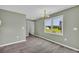 Open dining area with modern light fixture and view of the fenced backyard at 14807 Highway 36, Covington, GA 30014