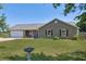 Charming single-story home with a well-maintained lawn and inviting curb appeal on a sunny day at 14807 Highway 36, Covington, GA 30014