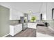 Kitchen featuring white cabinets, stainless steel appliances, and a view to the backyard at 14807 Highway 36, Covington, GA 30014