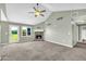Living room boasts vaulted ceilings, lots of light and a brick fireplace at 14807 Highway 36, Covington, GA 30014