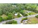 Aerial view of a property with mature trees, lush landscape and neighboring homes, near the road at 1830 Lost Mountain Rd, Powder Springs, GA 30127