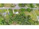 An aerial view of the property featuring lush greenery, mature trees, and a well-manicured lawn at 1830 Lost Mountain Rd, Powder Springs, GA 30127