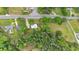 Aerial view of the property showcasing its location, mature trees, and surrounding landscape at 1830 Lost Mountain Rd, Powder Springs, GA 30127