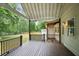 Spacious back porch with railings overlooking a large backyard at 1830 Lost Mountain Rd, Powder Springs, GA 30127