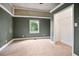 Bedroom featuring green walls, carpeted floors, and a closet at 1830 Lost Mountain Rd, Powder Springs, GA 30127