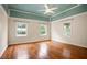 A primary bedroom featuring hardwood floors, a ceiling fan, and light and airy walls and ceiling at 1830 Lost Mountain Rd, Powder Springs, GA 30127