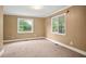 Roomy carpeted bedroom with natural light streaming through the window at 1830 Lost Mountain Rd, Powder Springs, GA 30127