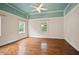 Inviting bedroom with hardwood floors, lots of natural light, and a unique ceiling at 1830 Lost Mountain Rd, Powder Springs, GA 30127