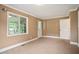 Bedroom featuring neutral paint and carpeting and an exterior-access door at 1830 Lost Mountain Rd, Powder Springs, GA 30127