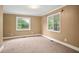 Bright bedroom with carpeting, neutral walls, and bright windows offering natural light at 1830 Lost Mountain Rd, Powder Springs, GA 30127
