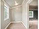 Bright bedroom showcasing neutral paint, carpet floors, and a large window at 1830 Lost Mountain Rd, Powder Springs, GA 30127