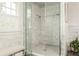 Elegant bathroom features a glass shower, marble tiling, and modern fixtures throughout at 248 Madison Ave, Decatur, GA 30030