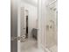 Bathroom featuring glass-enclosed shower and doorway leading to additional bathroom spaces at 248 Madison Ave, Decatur, GA 30030