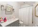 Charming bathroom featuring patterned wallpaper, modern vanity, and shower with white curtain at 248 Madison Ave, Decatur, GA 30030