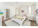 Bright bedroom with stylish rug, decor, and ensuite bathroom at 248 Madison Ave, Decatur, GA 30030
