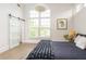 Bright bedroom with high ceilings and large windows provides a bright, airy retreat at 248 Madison Ave, Decatur, GA 30030