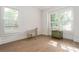 Bright bedroom with two windows, hardwood floors, and unique decor accents at 248 Madison Ave, Decatur, GA 30030