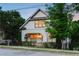 Charming two-story home featuring an arched front porch and beautifully landscaped front yard at 248 Madison Ave, Decatur, GA 30030