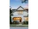 Front view of home at twilight featuring a covered porch and manicured lawn at 248 Madison Ave, Decatur, GA 30030