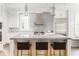 Bright kitchen with stone countertops, stainless appliances, and a center island with bar seating at 248 Madison Ave, Decatur, GA 30030