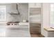 Bright kitchen with stone countertops, stainless appliances, and subway tile backsplash at 248 Madison Ave, Decatur, GA 30030