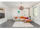 Comfortable living room with neutral colors, modern decor, and shuttered windows at 248 Madison Ave, Decatur, GA 30030