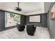 Movie room with comfortable seating, large screen, and contemporary artwork at 248 Madison Ave, Decatur, GA 30030