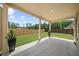 Spacious covered patio overlooking the well-manicured, fenced backyard at 2947 Knob Creek Dr, Snellville, GA 30078