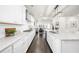 Bright, open kitchen with white cabinets, granite countertops, and stainless steel appliances at 2947 Knob Creek Dr, Snellville, GA 30078
