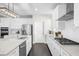 Modern kitchen showcasing white cabinets, stainless steel appliances, and a stylish subway tile backsplash at 2947 Knob Creek Dr, Snellville, GA 30078