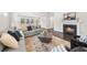 Cozy living room with a fireplace and large windows bringing in natural light at 2947 Knob Creek Dr, Snellville, GA 30078