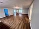 Spacious basement with wood-look flooring, neutral paint, and ample natural light from the door and window at 3515 Brandywine Nw Rd, Kennesaw, GA 30144