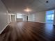 Open basement space features durable wood-look floors and a serving area with overhead lighting at 3515 Brandywine Nw Rd, Kennesaw, GA 30144