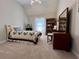 Comfortable bedroom with bed, dresser, bookcase, and large window offering natural light at 3515 Brandywine Nw Rd, Kennesaw, GA 30144
