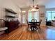 Cozy dining area features hardwood floors, a ceiling fan, and a view to the outdoor area at 3515 Brandywine Nw Rd, Kennesaw, GA 30144