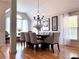 Bright dining room with hardwood floors, neutral walls, and stylish chandelier over the dining table at 3515 Brandywine Nw Rd, Kennesaw, GA 30144