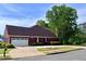 Brick home with a two-car garage, driveway, and manicured landscaping in a suburban setting at 3515 Brandywine Nw Rd, Kennesaw, GA 30144