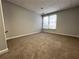 Neutral room with plush carpeting, soft paint and a window offering natural light at 3515 Brandywine Nw Rd, Kennesaw, GA 30144