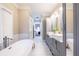 Elegant bathroom with double vanities, soaking tub and natural light at 883 Heritage Pl, Decatur, GA 30033