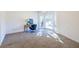 Bright bedroom featuring a cozy desk, a modern chair, and a bay window for natural light at 883 Heritage Pl, Decatur, GA 30033