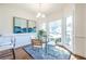 Bright breakfast nook with a glass top table, stylish chairs, and large windows with natural light at 883 Heritage Pl, Decatur, GA 30033