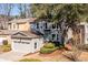 Charming two-story home with a two-car garage and mature landscaping at 883 Heritage Pl, Decatur, GA 30033
