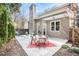Outdoor patio featuring stone pavers, dining area, and views of the home at 883 Heritage Pl, Decatur, GA 30033